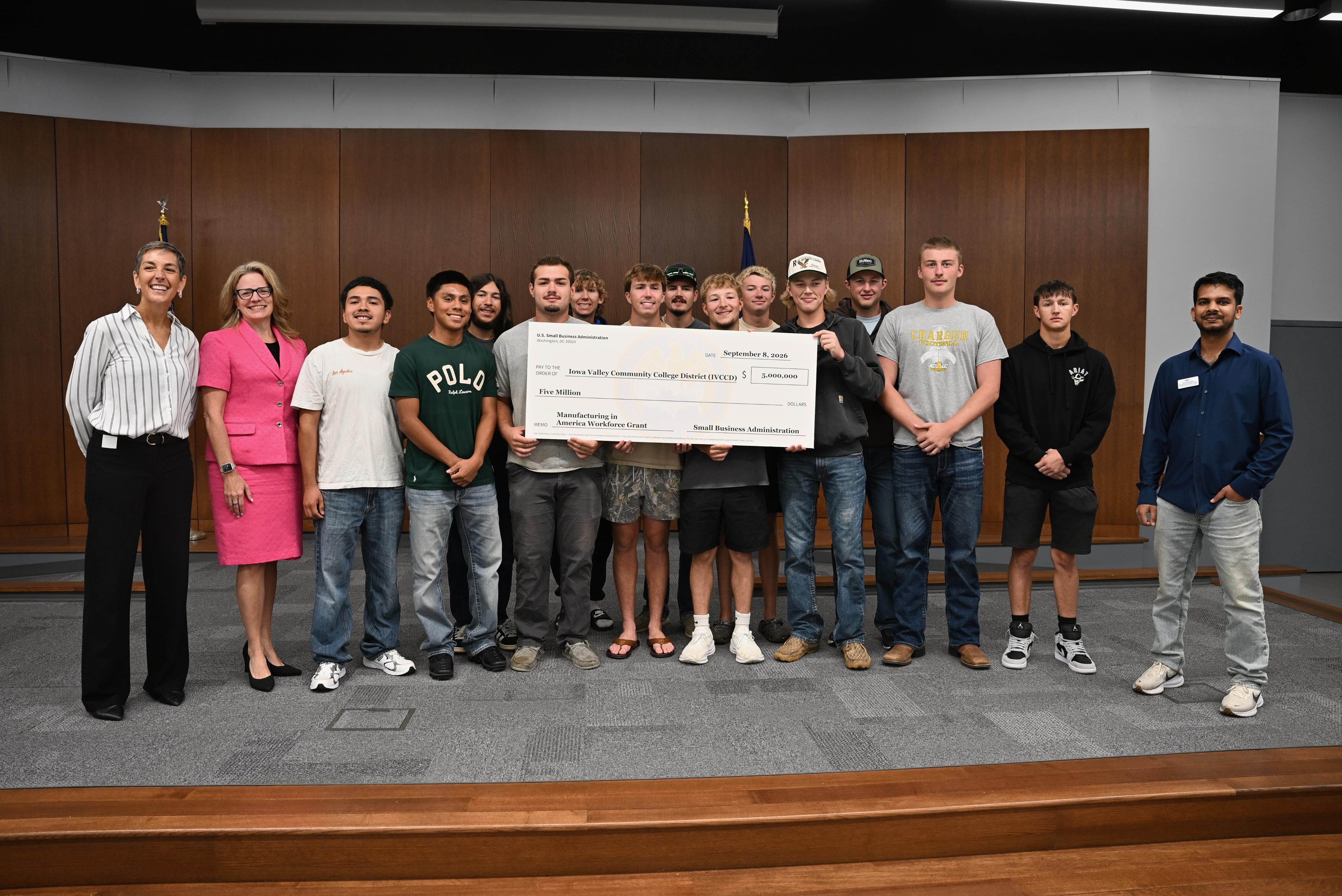 Iowa Valley Community College District and U.S. Small Business Administration officials join Robotics and Automation students to mark the presentation of a $5 million manufacturing training grant.