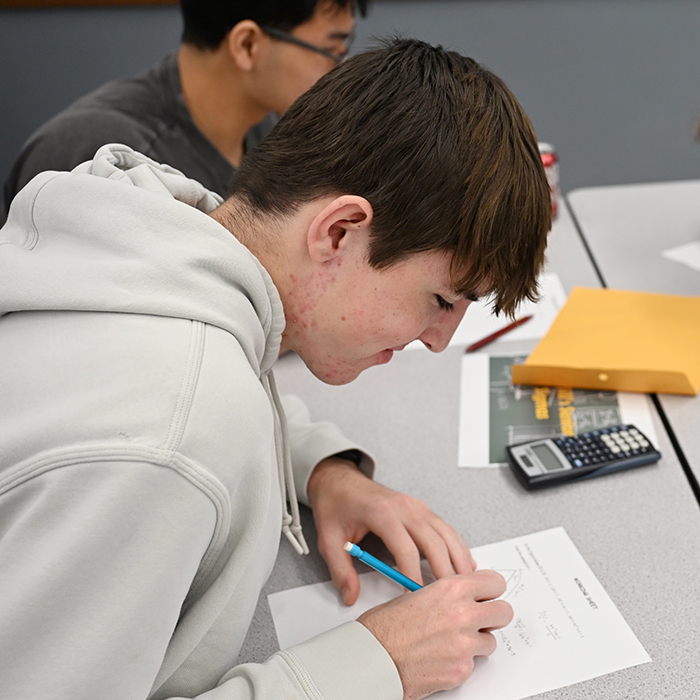 student working on math problem