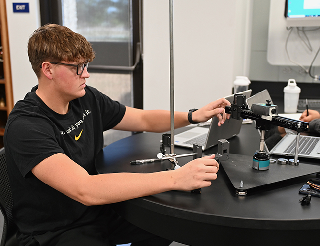 Engineering student working on lab