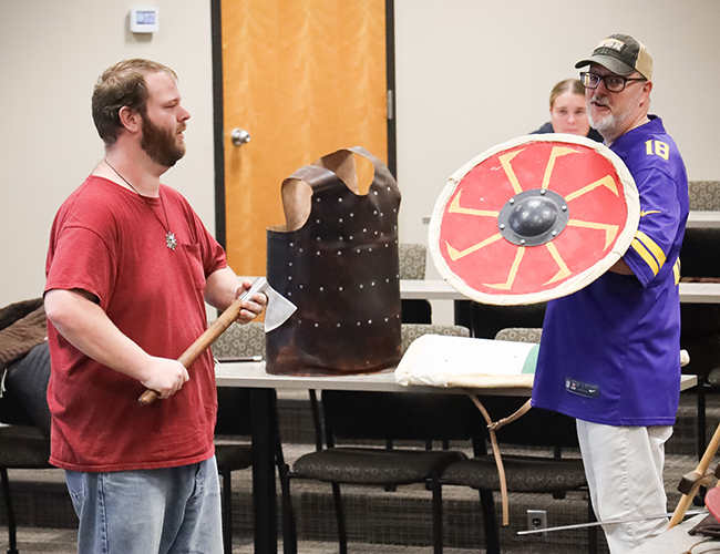 History looking at shields and swords