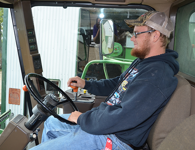 Precision Ag student in tractor