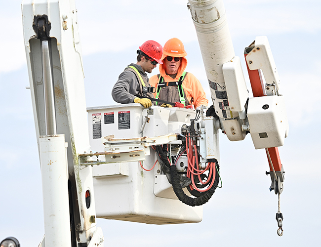 Utility Technician working in utility truck