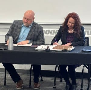 nursing-articulation-two-college-reps-sign-papers